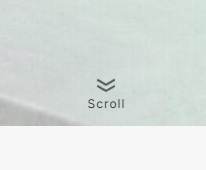 下矢印アイコンと「Scroll」というテキストで構成されたスクロール促進インジケーター